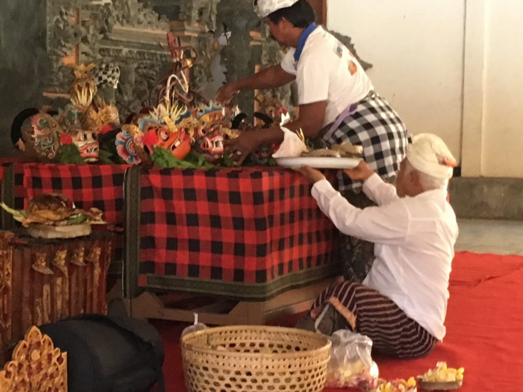 Sita's mask is added to all the others in preparation for the blessing. 